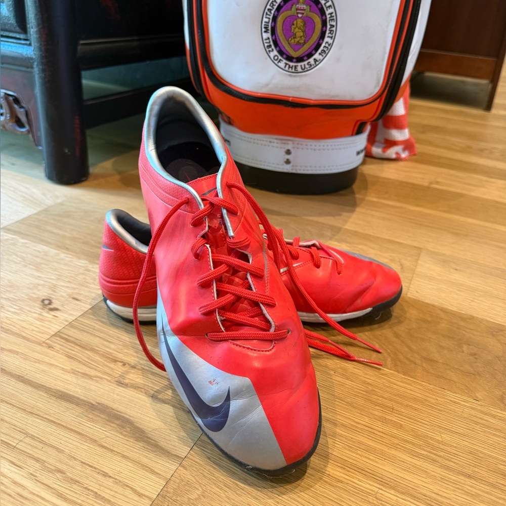 Gray and Red Athletic Shoes could be used for Golf could be used for soccer